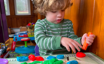 You're Less Alone Than You Think - Kid playing with playdough