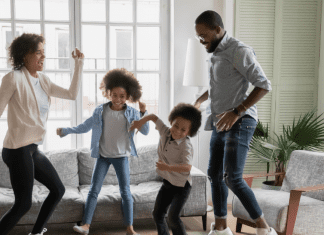 parents and kids finding joy while dancing in their living room