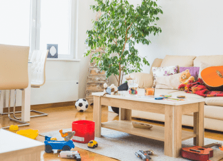 a messy living room with toys and items all over the place