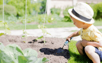 toddler digging in the dirt