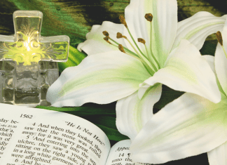 a cross, easter lilies and a bible, to teach kids about easter