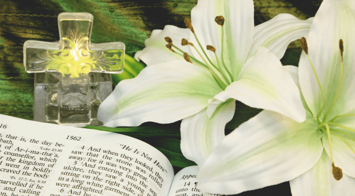 a cross, easter lilies and a bible, to teach kids about easter