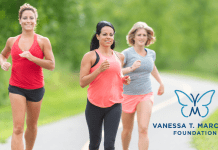 women running helping each other stay safe and motivated