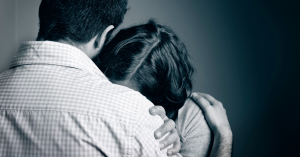 couple embracing after pregnancy loss